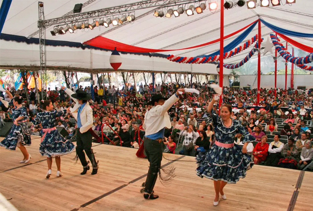 A lively fonda at night with traditional music and dancing