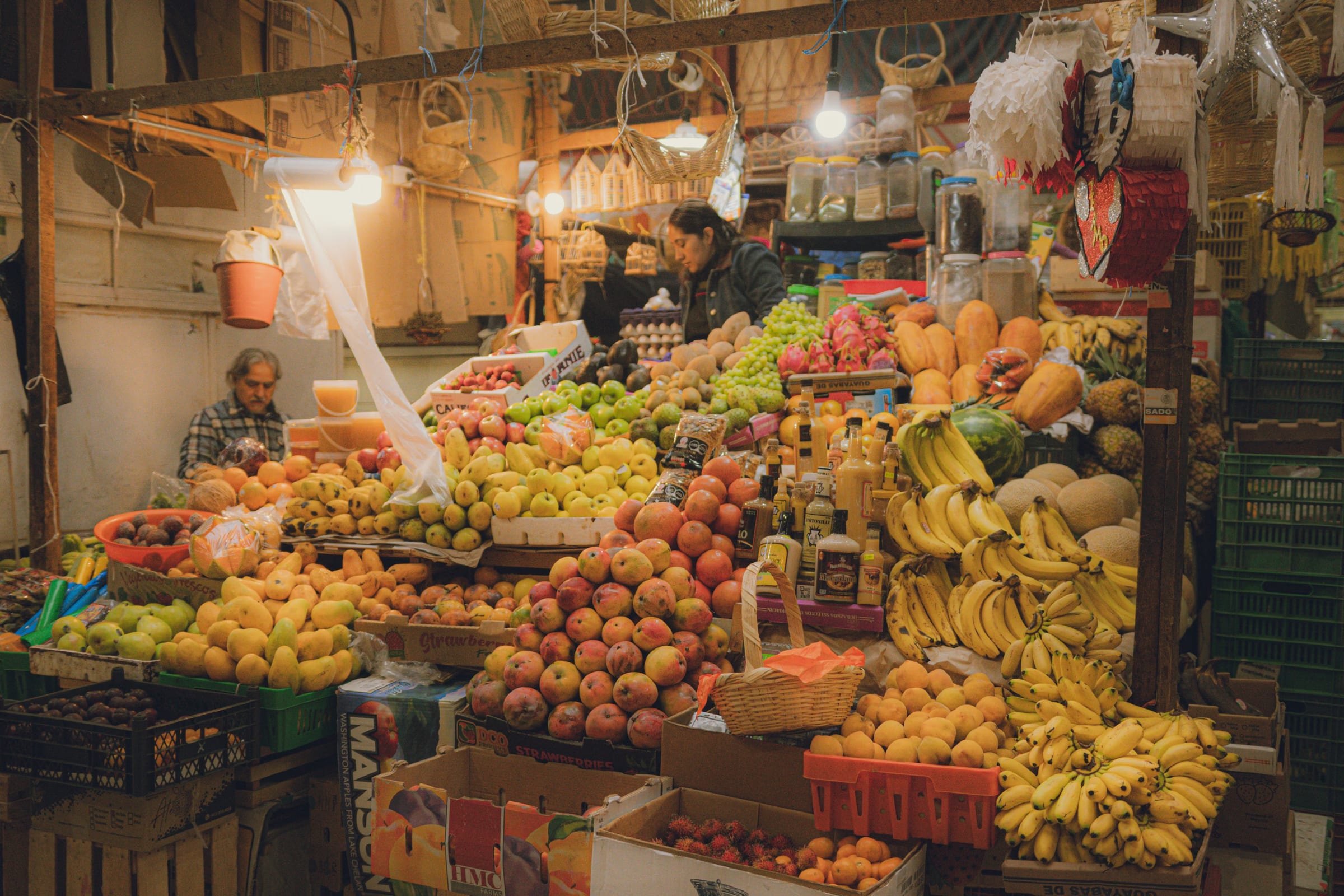 Colorful fruit stall in Marcado Central, showcasing a variety of fresh produce in a bustling market.